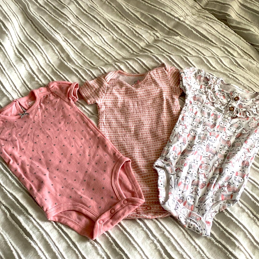 3 Pink with patterns baby onesies, size 3-6 M. NEVER WORN.